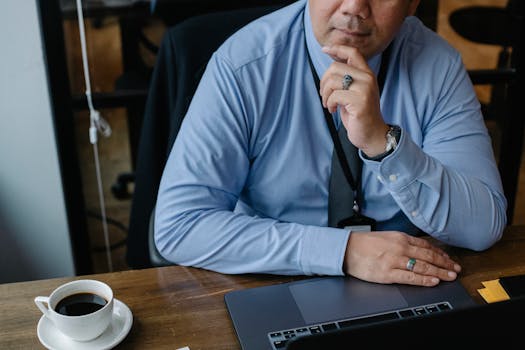 retired man using laptop to manage finances