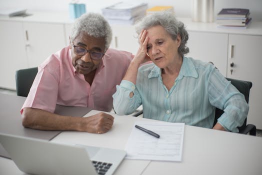 retired couple discussing finances at home