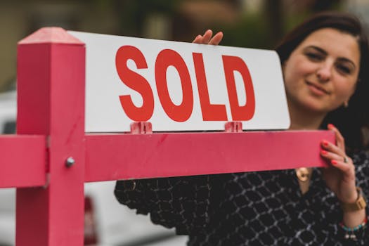 smiling retiree holding keys to new home