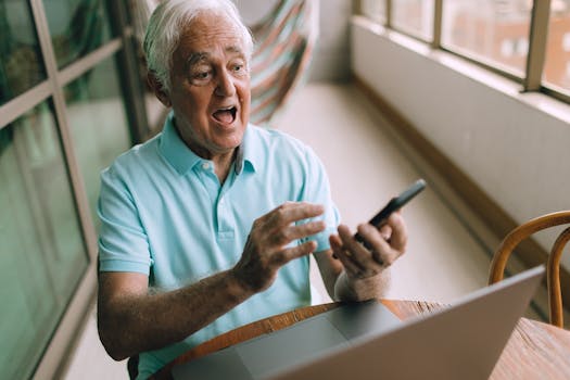 Retired man using a laptop to check finances