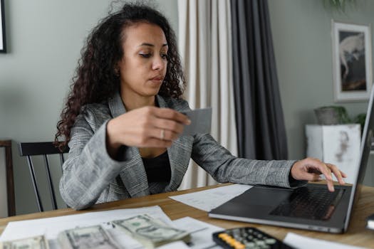 retired woman using a laptop to manage finances