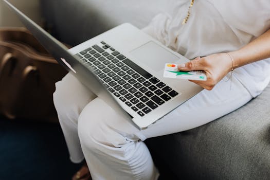 person checking credit score on laptop