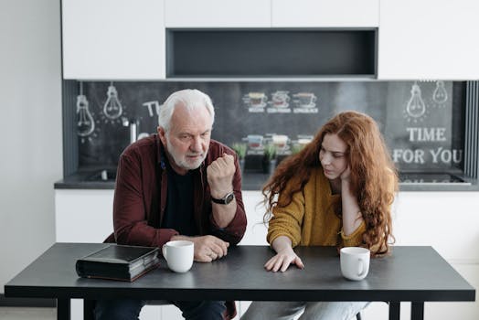 family discussing finances at the kitchen table