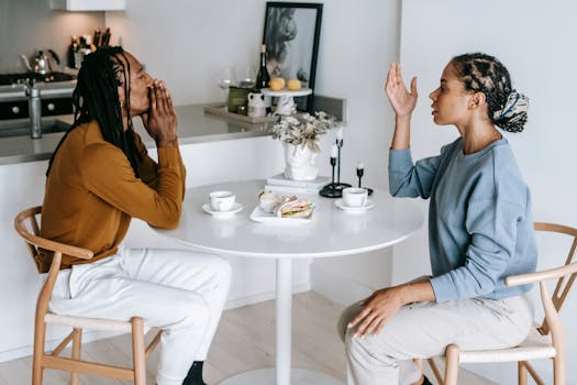 couple discussing finances at kitchen table
