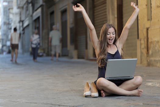 retired woman smiling while using a laptop