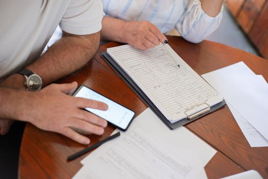 older man reviewing bills at home