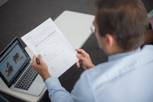 retired man reviewing tax documents