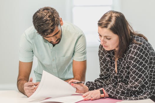 homeowner signing mortgage documents