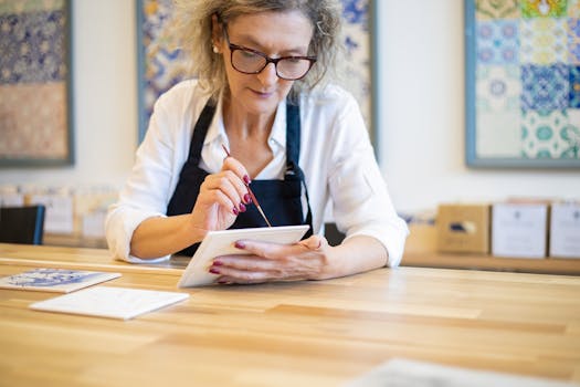 senior woman painting in a sunny studio