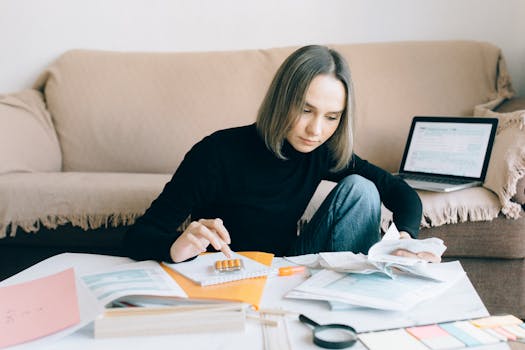 person holding a calculator and mortgage papers