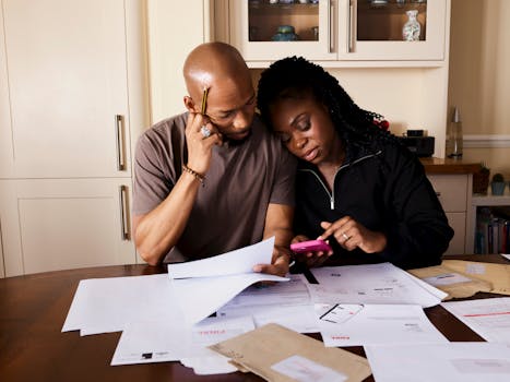 older couple reviewing mortgage documents at home
